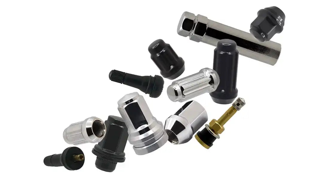 Collection of tire valve stems and caps in black and silver finishes.